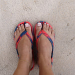 Red and Blue Slappas durable arch support thongs worn as casual footwear