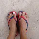 Red and Blue Slappas durable arch support thongs worn as casual footwear